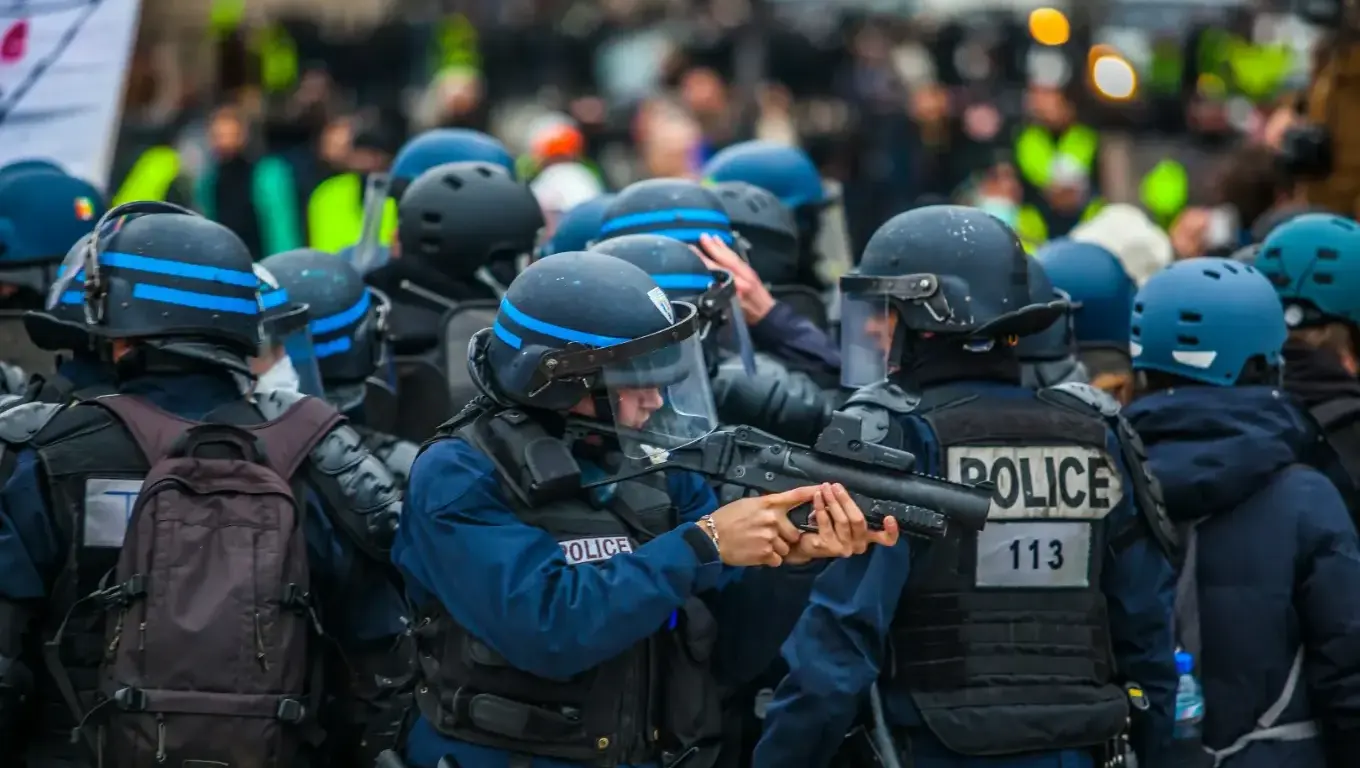 blue and black uniformed police on street